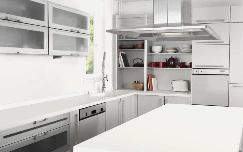 Aluminum kitchen cabinets in a bright kitchen with exhaust hood over kitchen island
