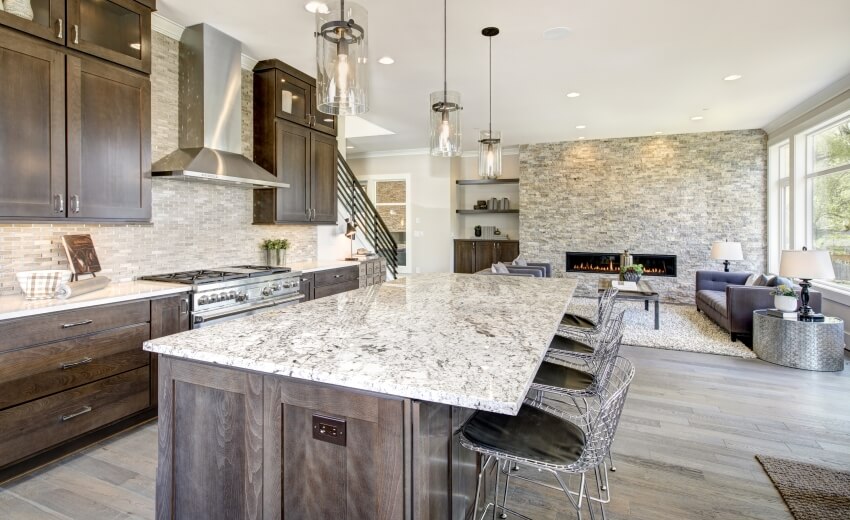 Kitchen with wrought iron breakfast chairs and weathered look cabinets