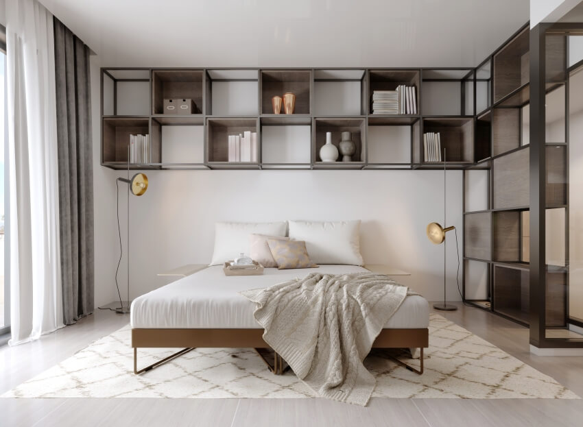 Minimalist industrial bedroom features metal square shelves with décor over the bed