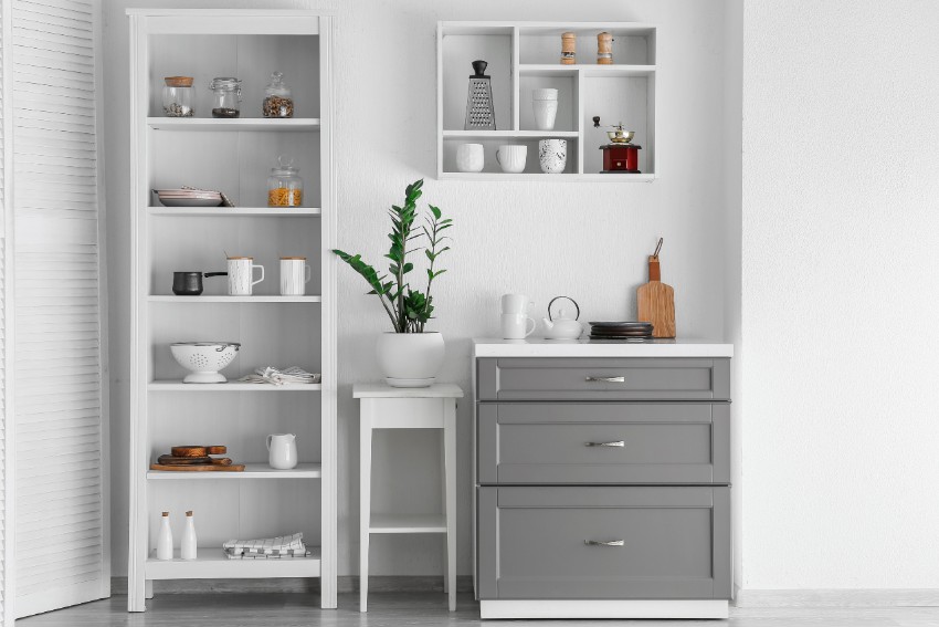 Minimalist white and gray kitchen with storage racks