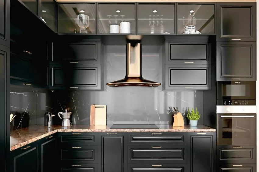 Modern interior kitchen with black cabinets, dark gold trim and brown granite countertop