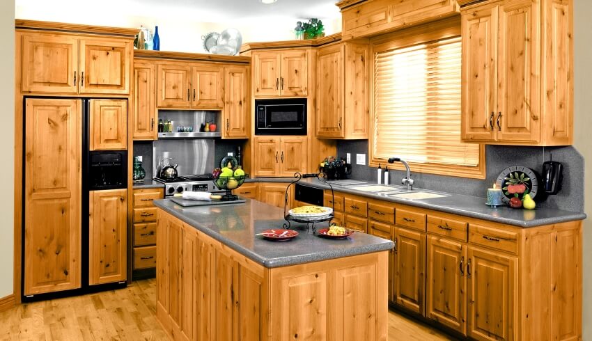 Modern kitchen with cedar cabinets, hardwood floors, and grey countertops and backsplash