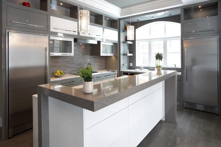 Modern kitchen with hardwood floor, aluminum cabinets, and granite countertop island