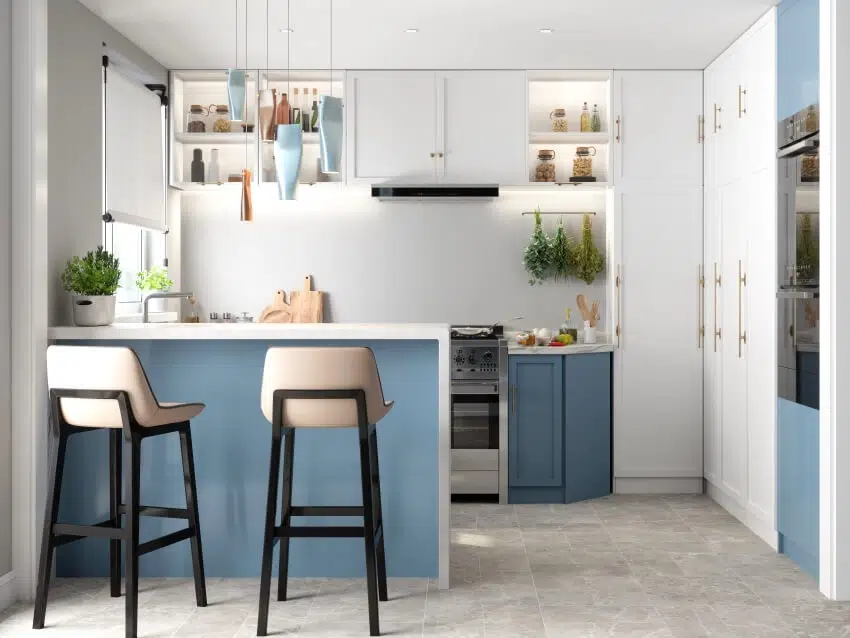Kitchen with blue peninsula base, white countertops and chairs with black finish legs
