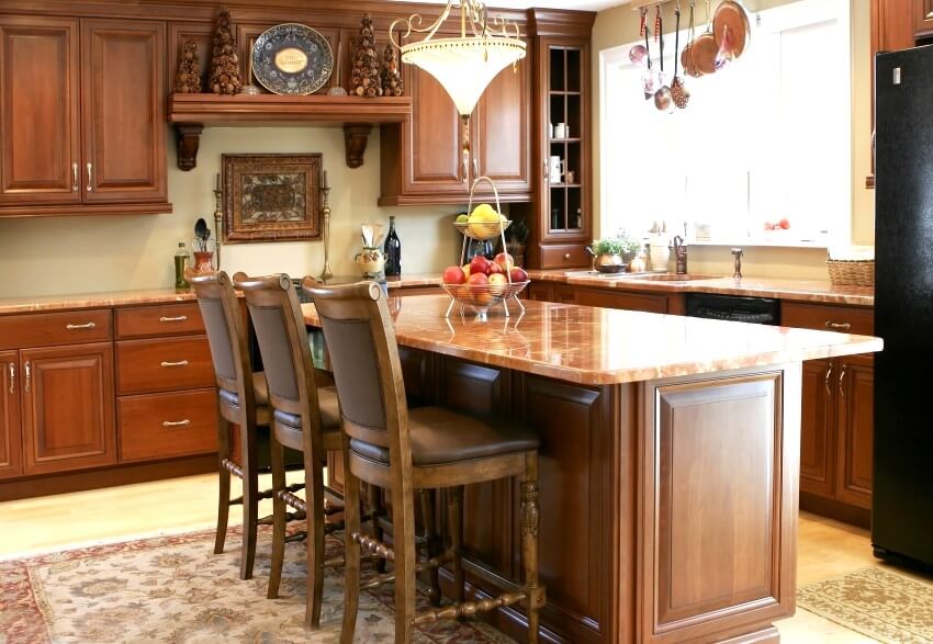 Modern luxury kitchen with cherry cabinets and juperana arandis granite countertops