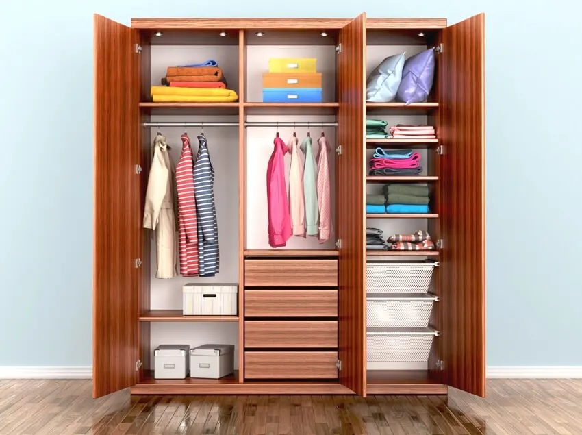 Open freestanding wardrobe compartment with organized clothes