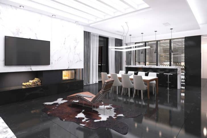 Open Kitchen And Living Room With A Fireplace Skyligth Windows And Black Granite Floors Is 728x486 