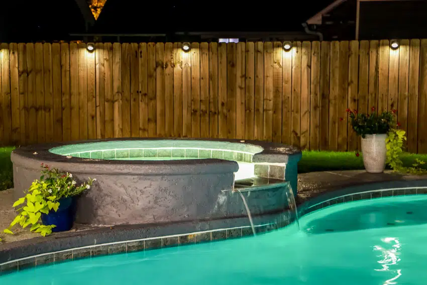 LED lights, swimming pool, jacuzzi, and deck