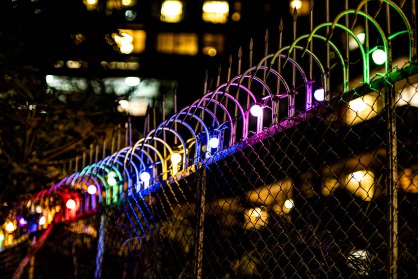Outdoor metal wire fence with multicolor lights