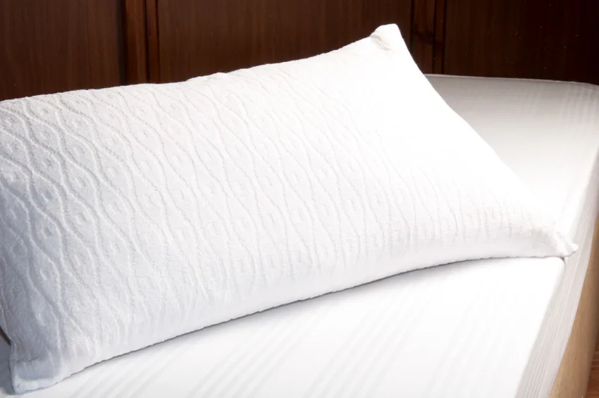 Pillowcase on top of bedding