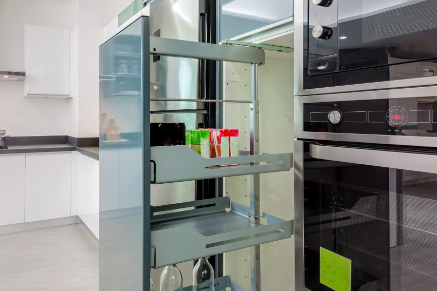 Pull out pantry kitchen drawer in the kitchen for bottles