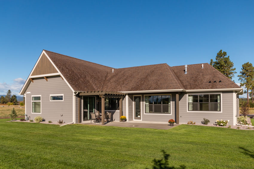 Suburban ranch house with brown roof