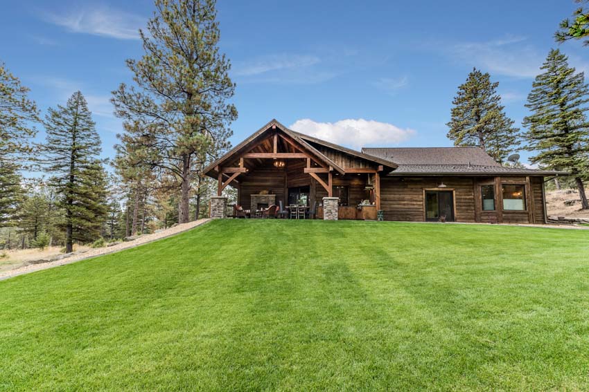 Rustic ranch with patio and lawn