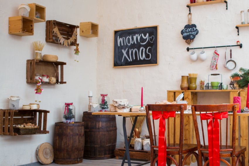 Rustic style kitchen with board accents and repurposed crates mounted on the wall