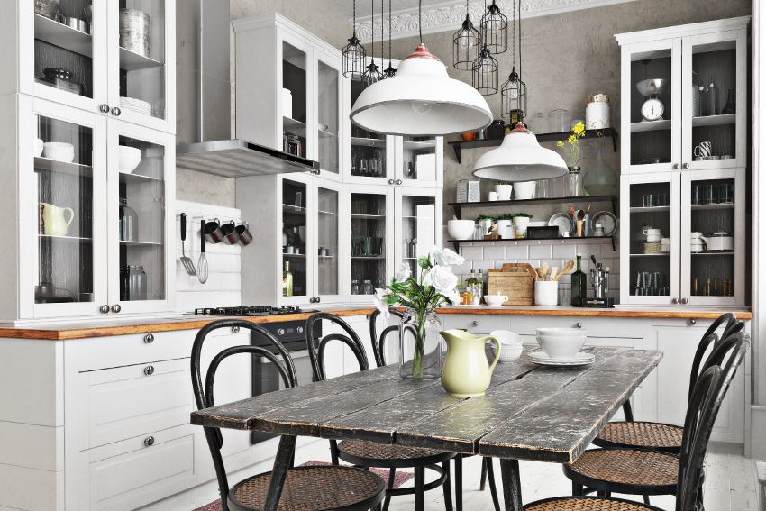 Scandinavian style kitchen with hutch cabinets, eating area and simple accents