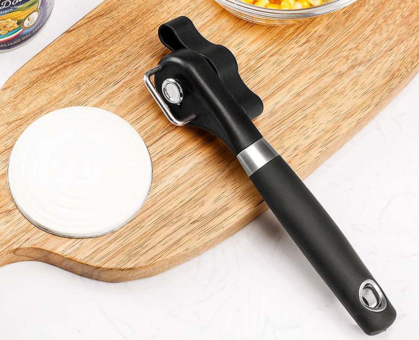 Smooth edge can opener on cutting board