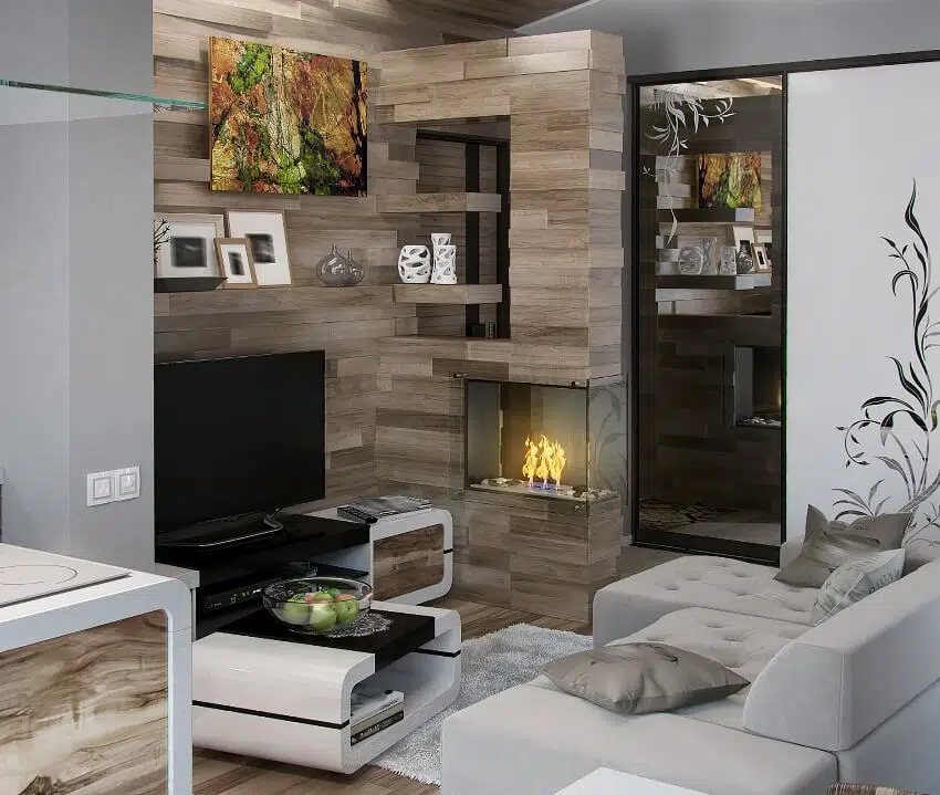 Room with gray sofa, patterned wood walls and shelves