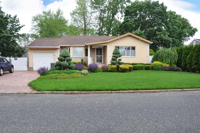 Suburban ranch with driveway and garage