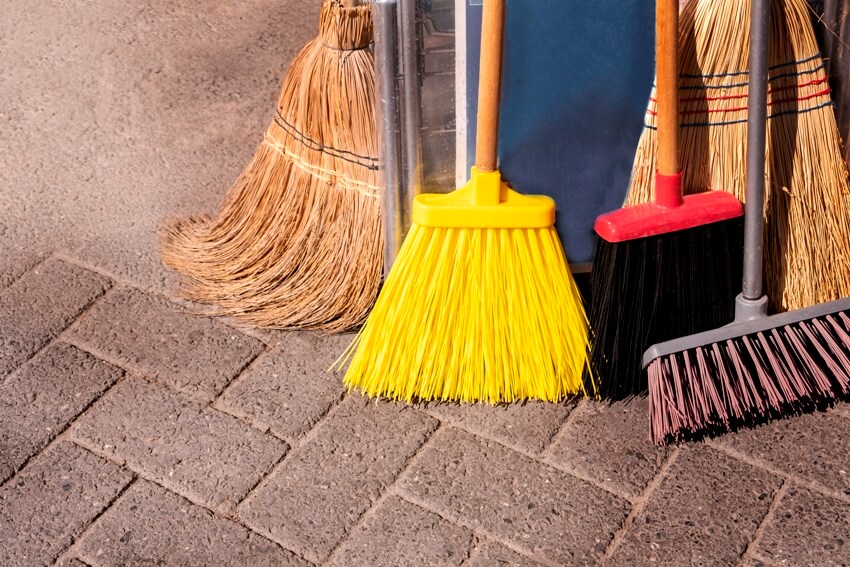 Types of brooms on concrete floor