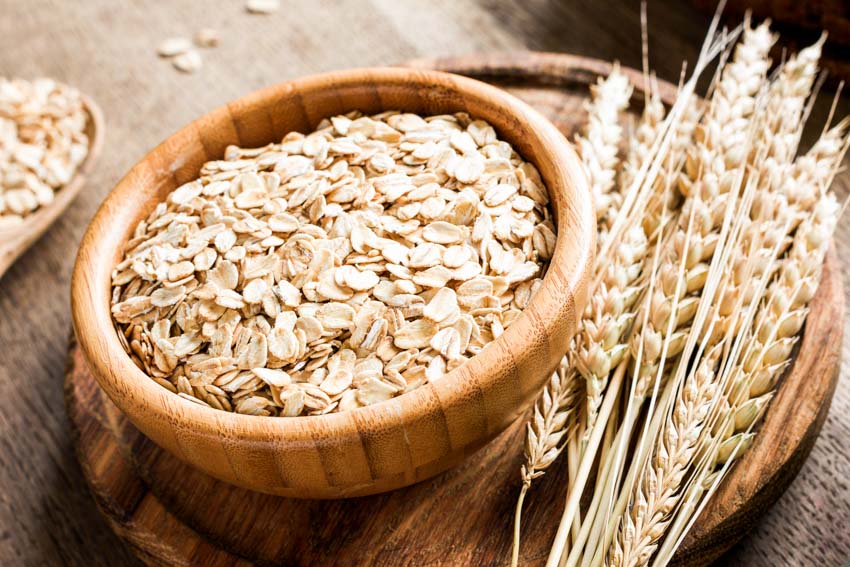 Wood bowl with oats in it