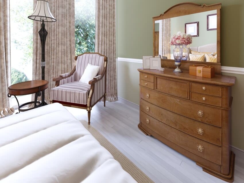 Wooden dresser with mirror and sliding lockers in a classic bedroom