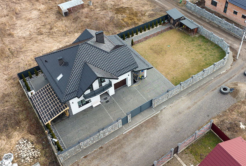 House and lot with black roof white paint