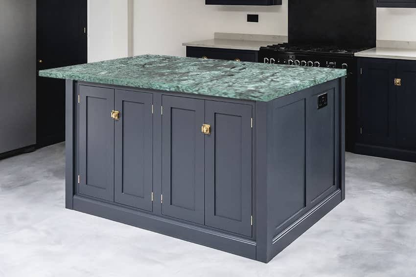 Kitchen with black kitchen island amazonite countertop marble flooring