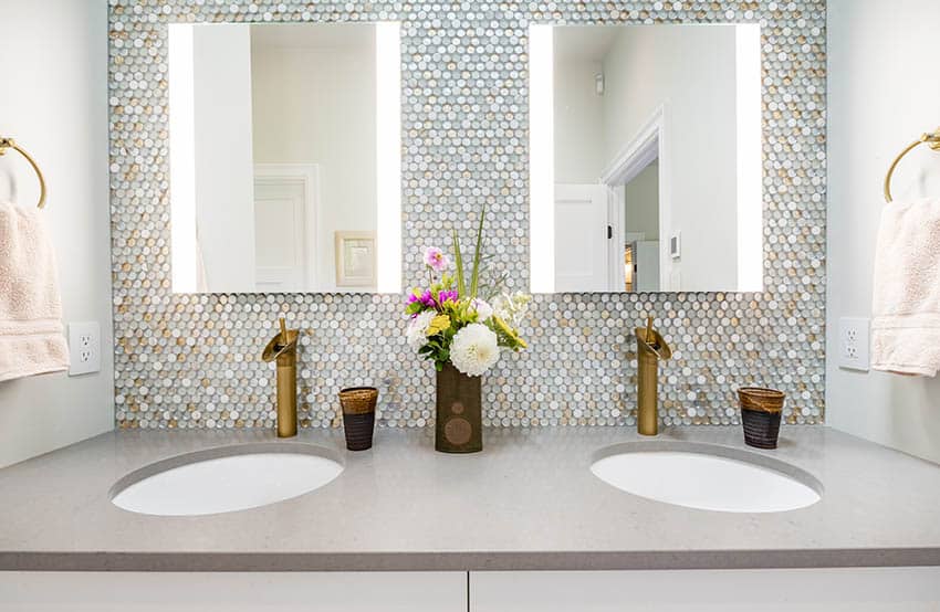 Bathroom vanity with glass penny tile backsplash