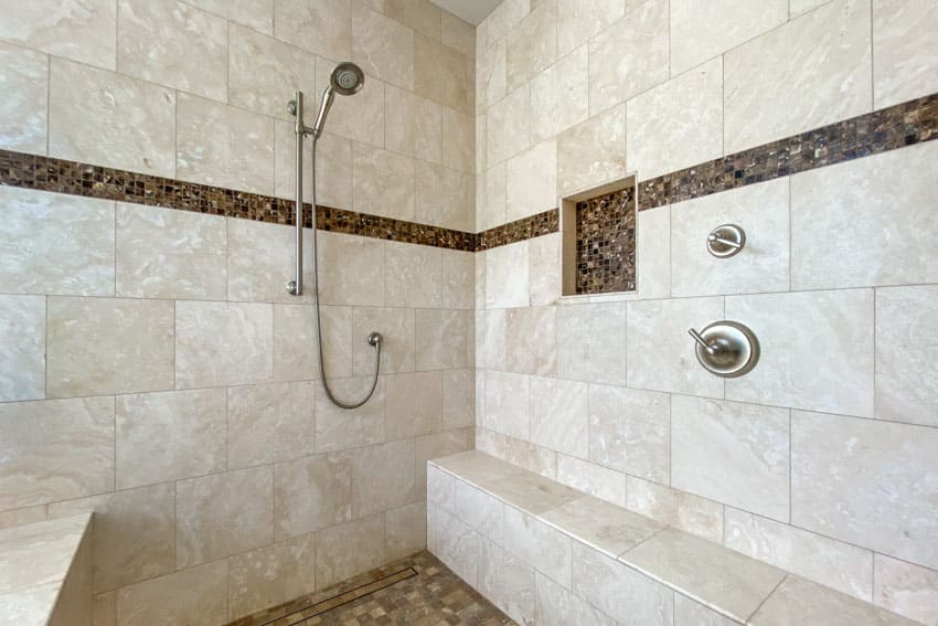 Bathroom with listello tile shower and showerhead