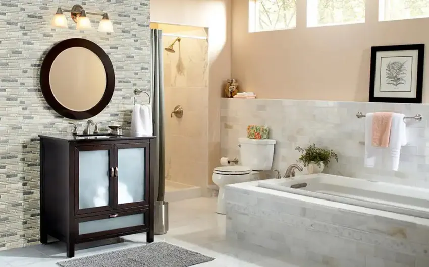 Bathroom with vanity area, mirror, windows, shower area, and mosaic Calcatta gold backsplash