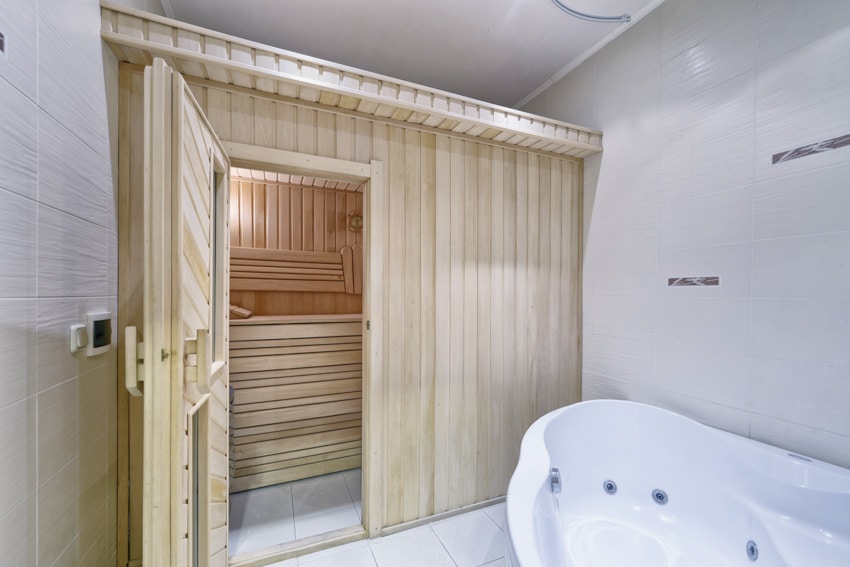 Bathroom with birchwood walls and slate wall tiles