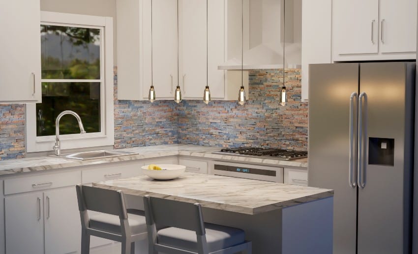 A beautiful and clean kitchen with marble countertops, multicolored slate backsplash, white cabinets and kitchen island