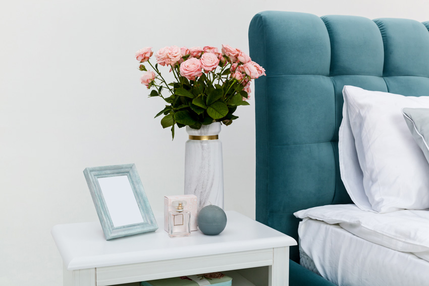 Bedroom with nightstand and table flower holder