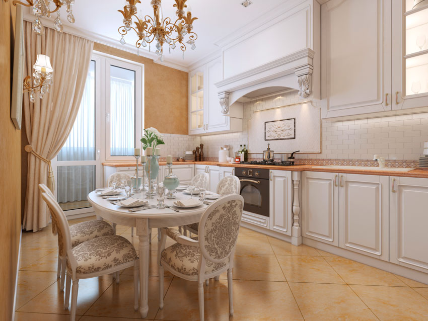 Kitchen with porcelian tile, upholstered chairs and wall sconce with decorative elements