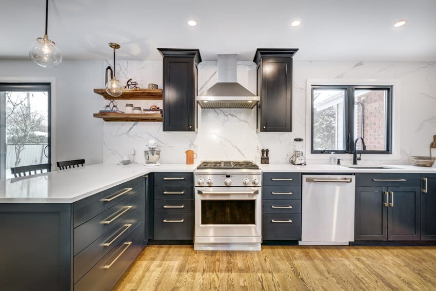 Contemporary kitchen with marble slab backsplash, cabinets, wood floors, range hood, cabinet hardware, shelves, oven, and windows ss