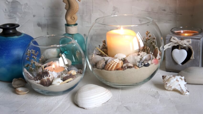 Decorative vases with sand and seashells