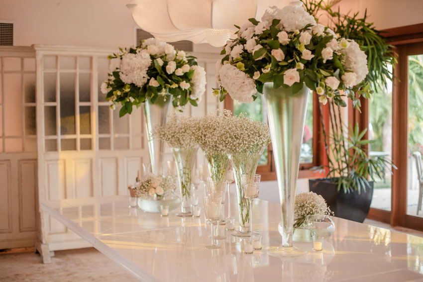 Dining table with trumpet vases 