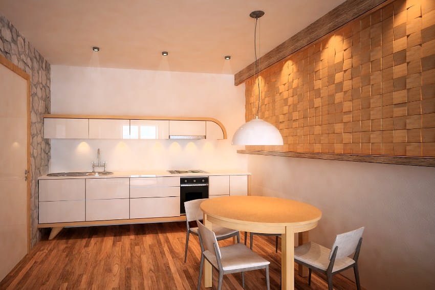 Dinning room with okoume blocks accent panel, kitchen counter, round table, luster and four chairs