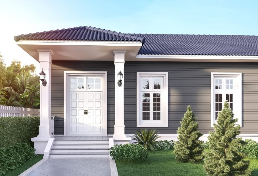 Front house entrance with porch columns, white door, dark gray plank wall, and black roof tile