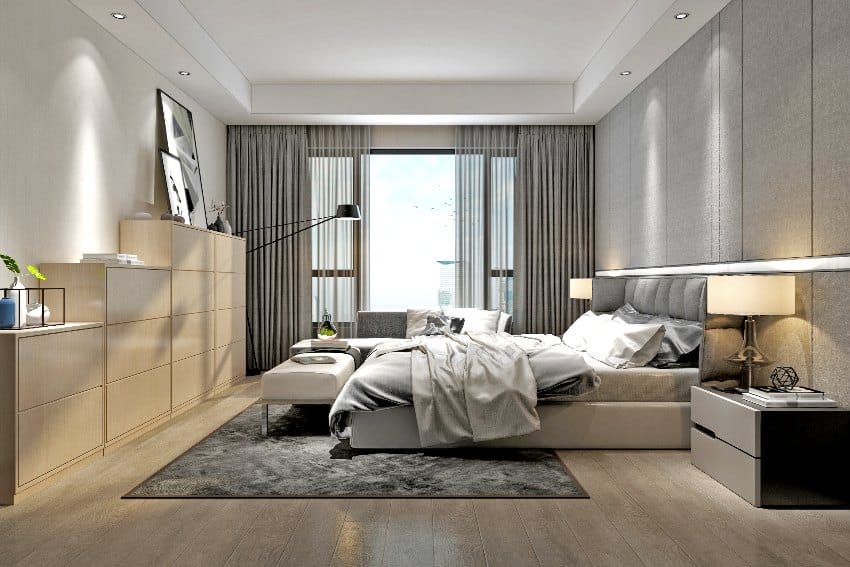 Furnished modern bedroom interior with recessed valance lighting