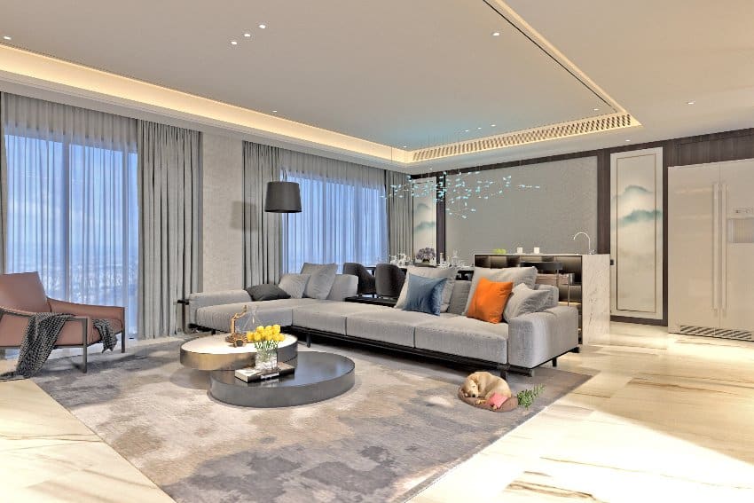 Furnished modern elegant living room interior with gray carpet and cove lighting