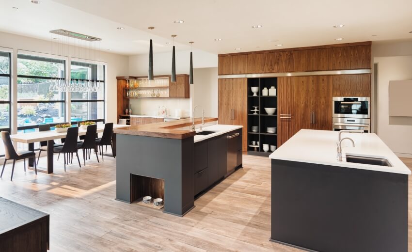 Gray and brown luxurious kitchen with modern wood cabinets and two islands