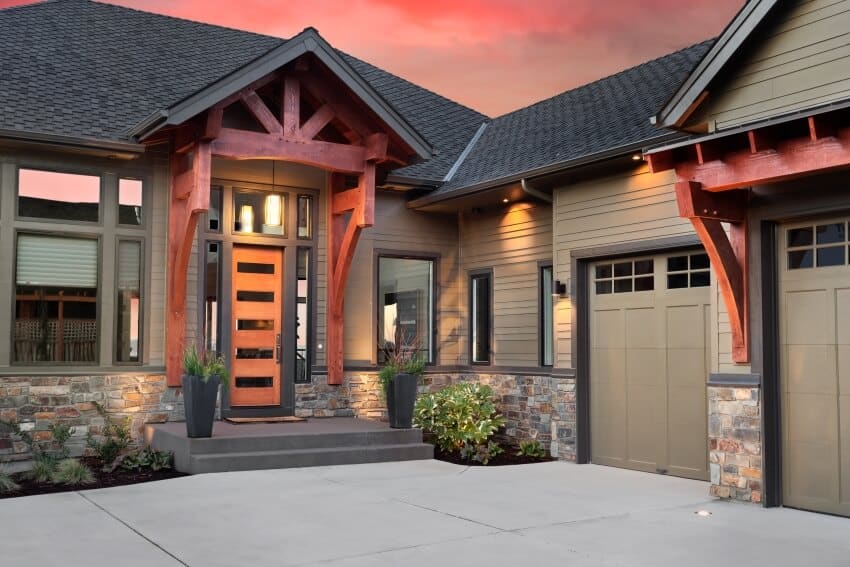 House with taupe siding and stone cladding