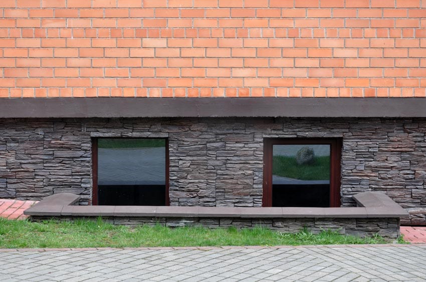 House with brick walls and basement windows