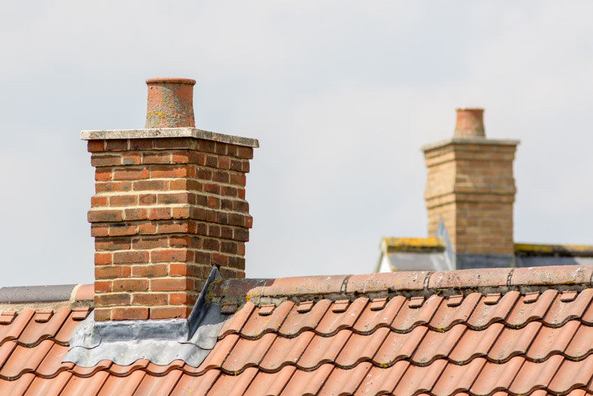 House roof with chimneys and chimney liner
