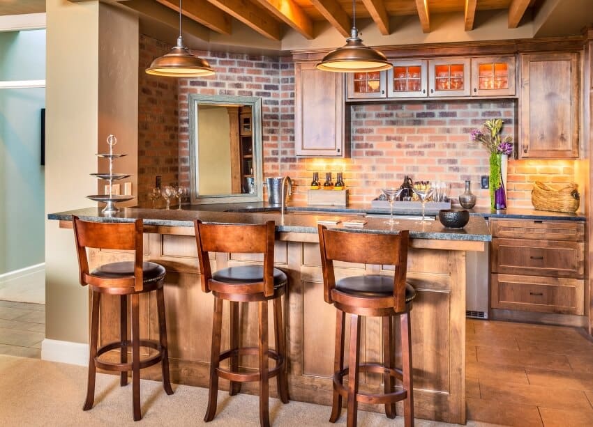 Kitchen bar with brick backsplash, ceiling beams, acacia cabinets, and chairs