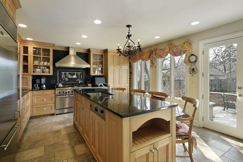 Kitchen with black countertops and tile flooring