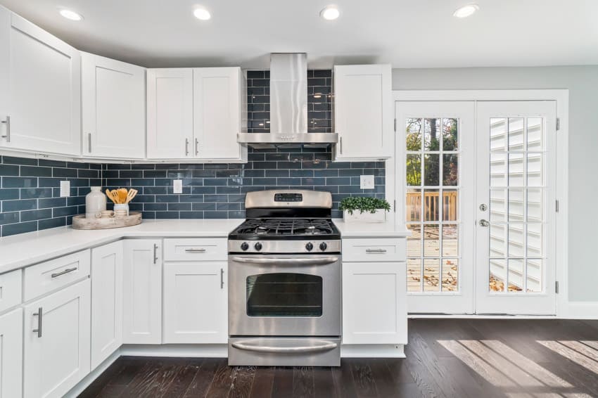 Blue backsplash in white kitchen