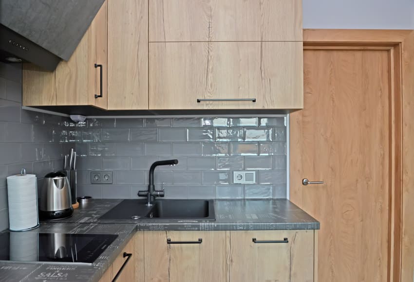 Kitchen with gray backsplash