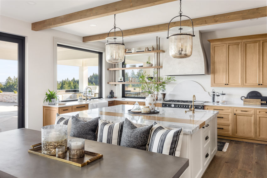 Marbled countertop with exposed wood ceiling beams